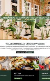Ein einladendes Café mit grünen Pflanzen, hellen Wänden und einem gemütlichen Ambiente für Kaffeeliebhaber.